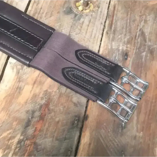 Black leather atherston elasticated leather girth with silver stainless steel buckles and detailed stitching