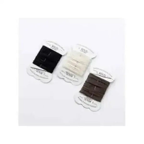 Three spools of wenzel plaiting thread in black cream and brown on white cards for horse grooming and plaiting thread complete kits