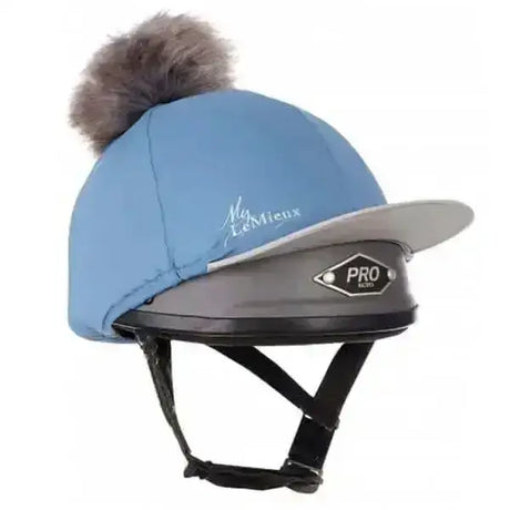 Light blue quilted pom hat silk ice blue lemieux helmet cover with gray faux fur pom pom and black pro logo brim