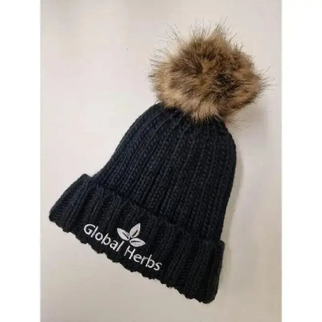 Black heavy ribbed knit pom pom hat with brown faux fur pom pom and white global herbs branded embroidery