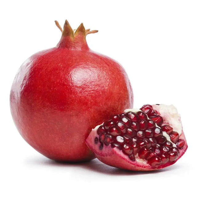 A vibrant red pomegranate with glossy textured skin split open to show juicy ruby red arils perfect for equestrian snacks