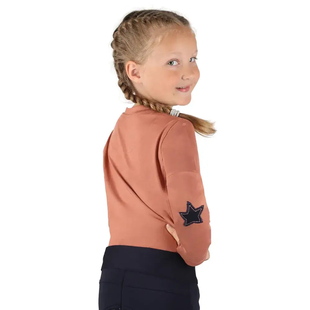 A soft blush long sleeved pony passion motif top with a star elbow patched on the left sleeve