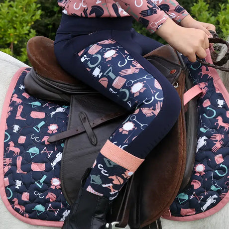 Navy riding tights with playful pink white and teal horse gear icons featuring passion print panels pony passion riding
