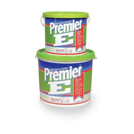 Two stacked green-lidded plastic buckets of premier e horse feed extra high in vitamin e supplement for nutritional input