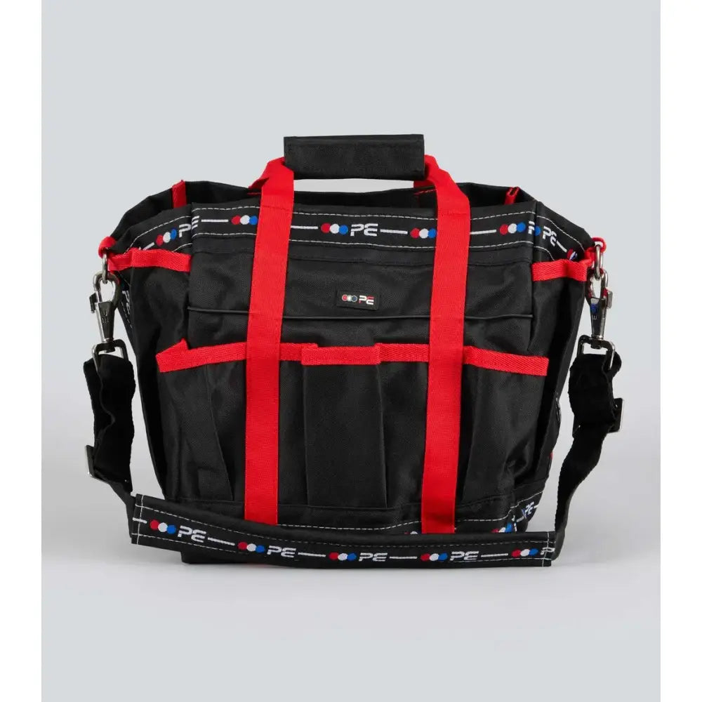 Black and red premier equine grooming kit bag with bold vertical straps and patterned pe logo trim perfect for grooming gear