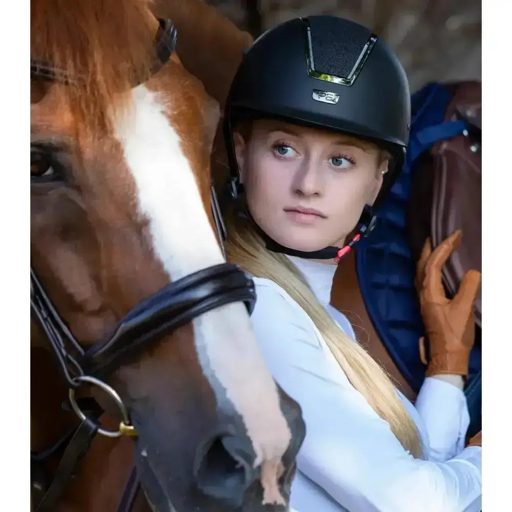 Black premier equine odyssey horse riding helmet with small silver logo for safe and stylish equestrian use