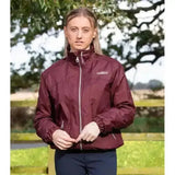 Maroon premier equine pro rider unisex waterproof riding jacket with high collar and silver zipper detailing