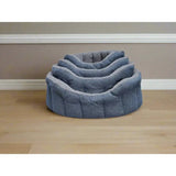 Stacked set of three gray orkney tweed fleece lined bolster beds with sherpa fleece lining and cozy quilted fabric