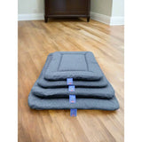 Stacked gray plush premium orkney tweed rectangular dog beds with stitched edges and blue brand tags by p&l country dog beds
