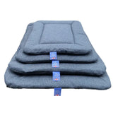 Stacked gray woolen premium orkney tweed rectangular pads with stitched edges and blue brand tags by p&l country dog beds