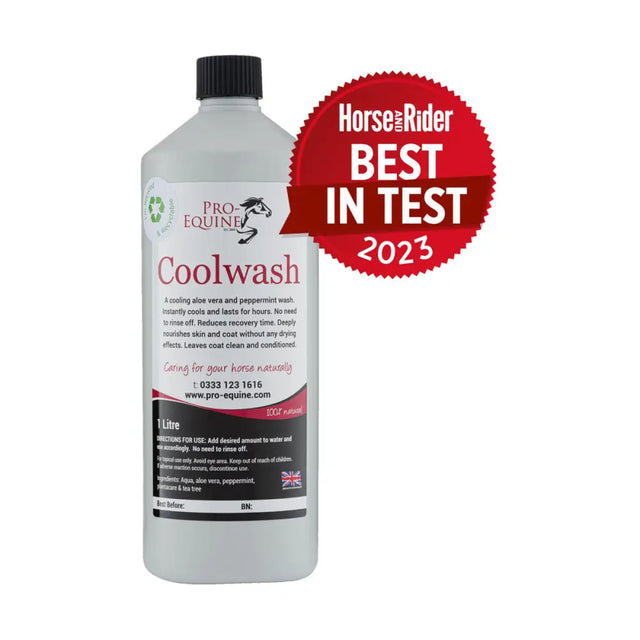 A translucent white plastic bottle with black cap labeled pro-equine coolwash for horse washes that coolwash removes sweat