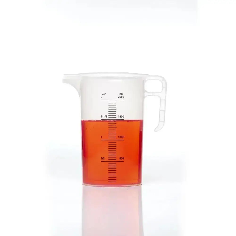 Clear plastic pro-measures pro-jug with white handle filled halfway with orange liquid designed for everyday commercial durability