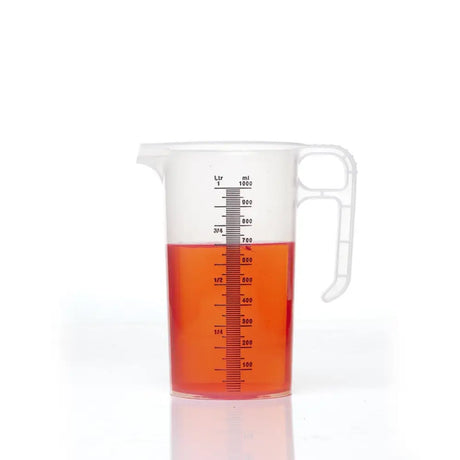 Transparent plastic pro-measures pro-jug with white handle and red liquid designed for everyday commercial durability