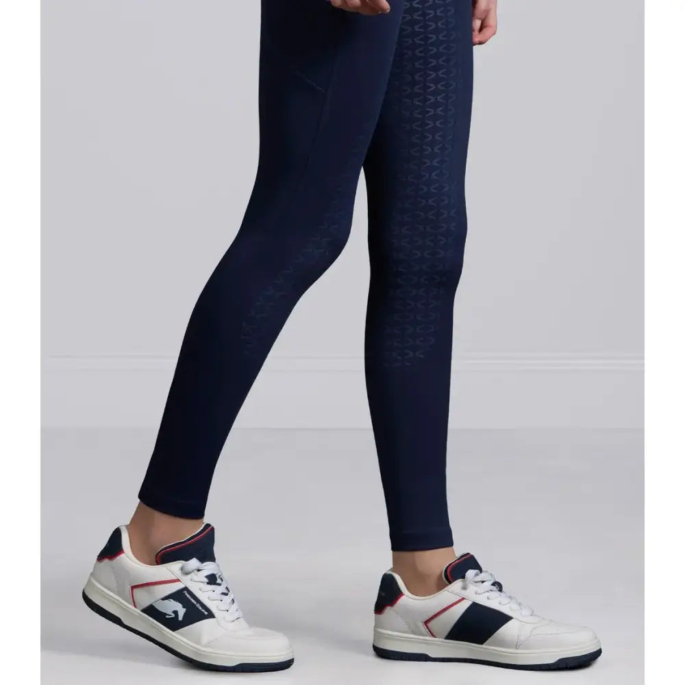 Navy prospero riding tights with a sleek fit and subtle textured pattern along the outer leg perfect for riding