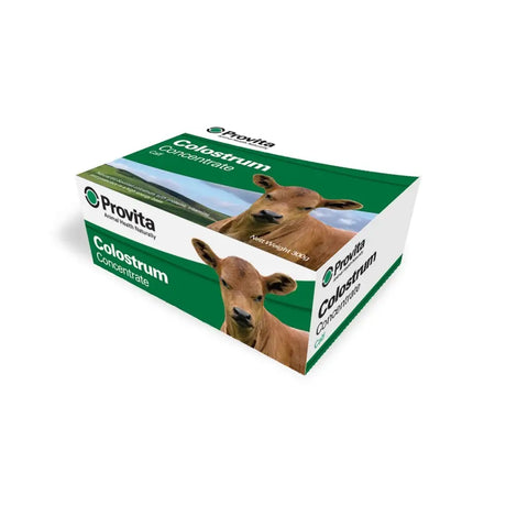 Green and white cardboard box of provita calf colostrum concentrate with brown calves natural eu sourced nutritional energy source