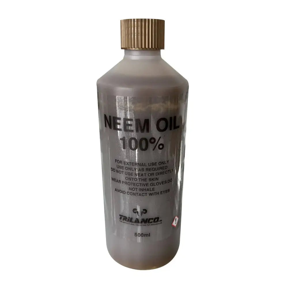 A clear plastic bottle of pure neem oil with a gold ribbed cap labeled 500ml for external use and fly repellents