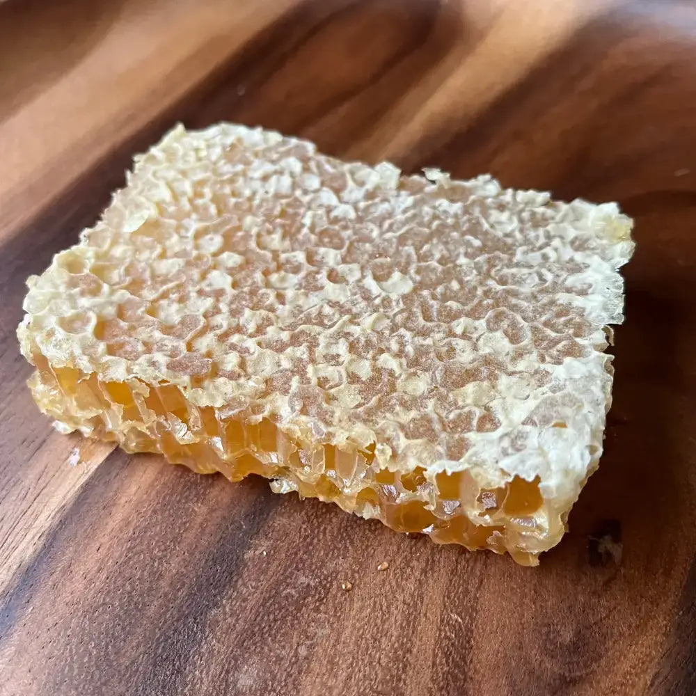 Golden devon honey comb with natural hexagonal wax cells filled with amber queens north devon honey