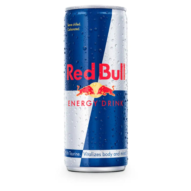 A chilled dewy red bull energy drink can with blue and silver design showing the red bulls logo for energy boost