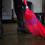 Red gorilla deluxe broom with vibrant red bristles blue woven bands and metallic handle grip for easy clean sweeps