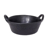 Black cast iron skillet with two looped handles and woven texture, perfect for cooking alongside red gorilla feed skip use