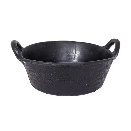 Black cast iron skillet with two looped handles and woven texture, perfect for cooking alongside red gorilla feed skip use