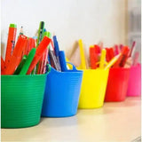 A row of colorful red gorilla flexible micro tubs made of plastic filled with assorted pens and markers