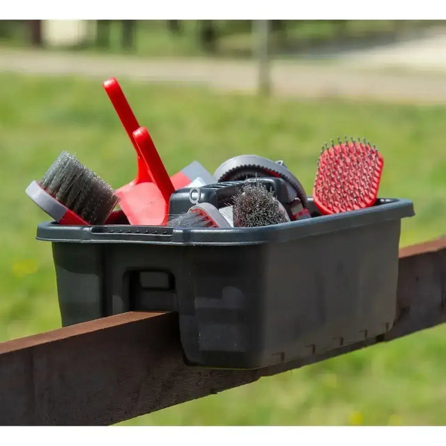 Black plastic horse grooming caddy with red and gray brushes and hoof pick by red gorilla plas tote tray black