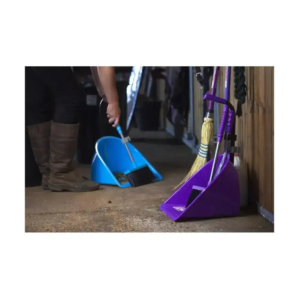 Purple plastic broom holder with attached yellow straw brooms and handles in red gorilla teenie tidee design