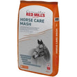 Orange and white bag of red mills horse care mash 18 kg with natural gastric buffer and grayscale horse bridle image
