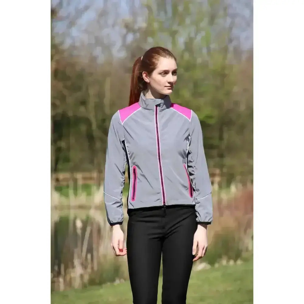 Gray and pink reflector jacket by hy equestrian with reflective zipper details perfect for darker evenings wearing