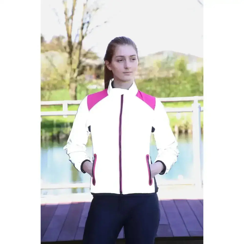 White and pink reflector jacket by hy equestrian with reflective panels for safer darker evenings wearing