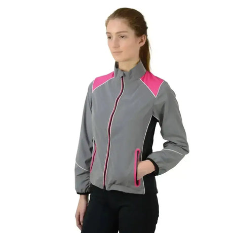 Gray and pink reflector jacket by hy equestrian with black accents full zipper and pockets for darker evenings wearing