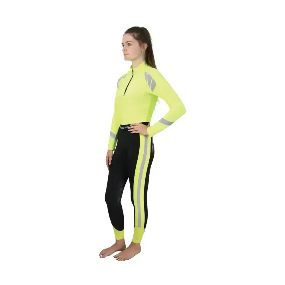 Bright neon yellow reflector riding tights top with reflective gray stripes paired with black reflector riding tights by Hy Equestrian