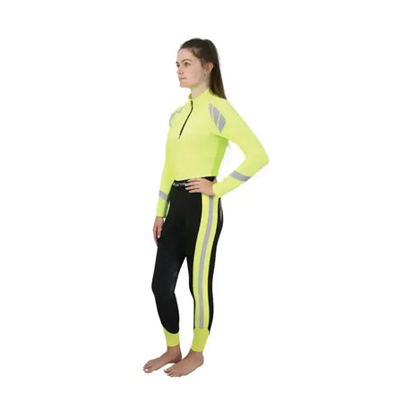 Bright neon yellow reflector riding tights top with reflective gray stripes paired with black reflector riding tights by Hy Equestrian