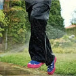 Black regatta kids stormbreak waterproof hydrafort polyester overtrousers with pink and blue rubber boots