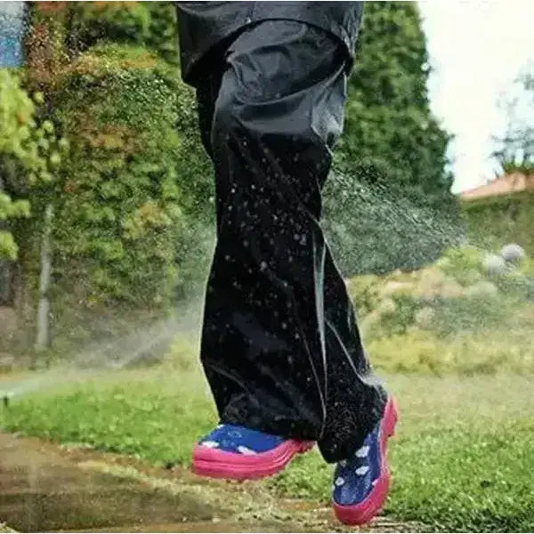 Black regatta kids stormbreak waterproof hydrafort polyester overtrousers with pink and blue rubber boots