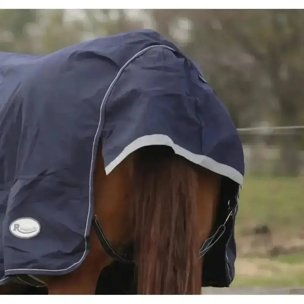 Navy blue rhinegold arizona 100g lightweight turnout rug with white trim and small logo on side full neck design