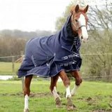 Navy blue rhinegold arizona 100g lightweight turnout rug full neck with reflective stripes and black buckles for warmth