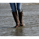 Brown leather Rhinegold Beaumont Country Boots in shallow water for outdoor adventures