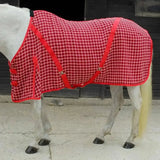 Red and white checkered rhinegold box weave cooler rug with red straps for horse warmth and comfort