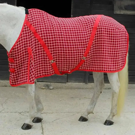 Red and white checkered rhinegold box weave cooler rug with red straps for horse warmth and comfort