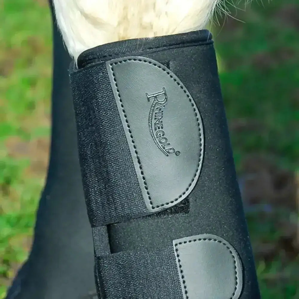 Black dainesegold leg wrap featuring gray leather-like patches and stitched detailing in rhinegold breathable neoprene boots
