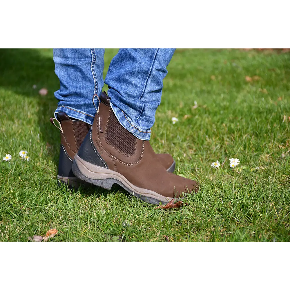 Brown leather Rhinegold Columbus Short Country Boot on grassy ground with elastic sides