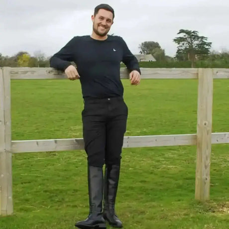 Black leather riding boots with glossy finish and reinforced toe caps paired with rhinegold elite mens thermal breeches