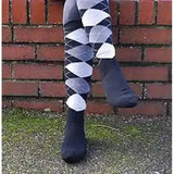 Black argyle patterned rhinegold fully cushioned sole riding socks worn over black socks for extra comfort