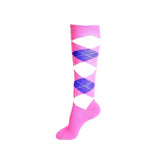 A vibrant pink rhinegold junior cool dry cushioned riding sock with blue argyle and a fully cushioned sole