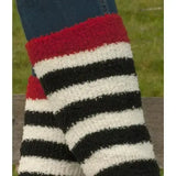Rhinegold junior soft touch knee high socks in red black and white fuzzy stripes worn over blue jeans
