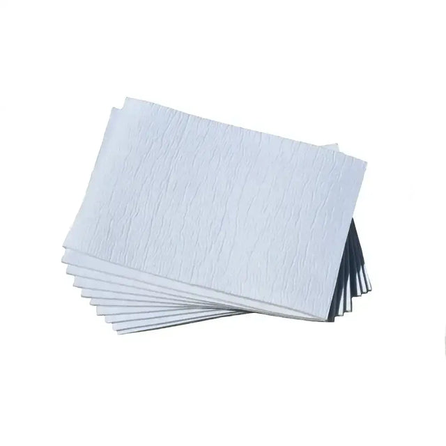 Stack of white textured rhinegold large gamgee pads made from soft layered cotton at barnstaple equestrian supplies