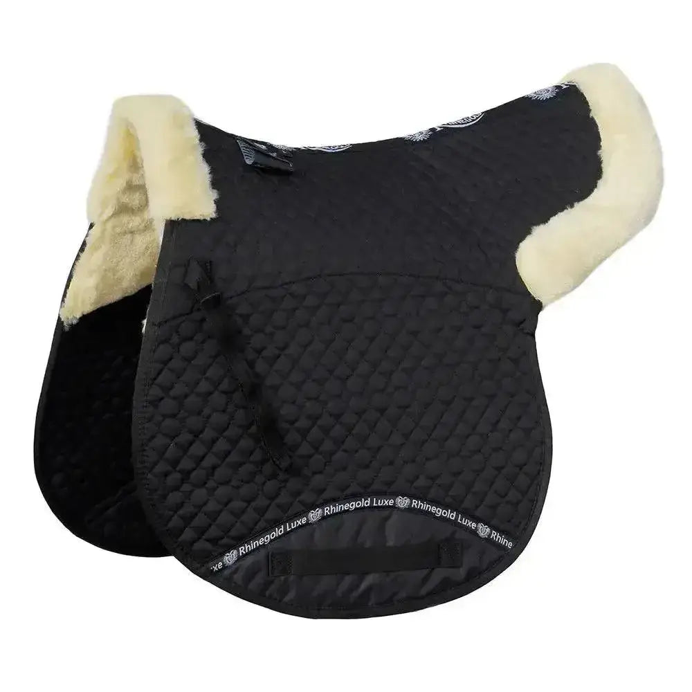 Black quilted saddle pad with cream fleece lining and rhinegold luxe fur branding along the edge for luxury comfort