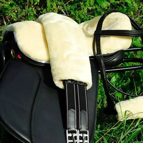 Black leather rhinegold luxe girth with cream sheepskin fur pile girth sleeve for extra comfort